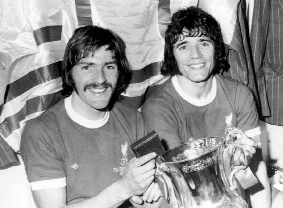 Steve Heighway and Kevin Keegan (R) celebrate with the FA Cup after Liverpool defeated Newscatle United in 1974.