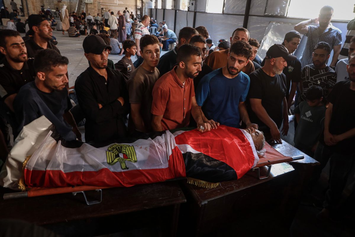 The funeral of aid worker Mohammed al-Wahidi, who helped organise the screenings, and died in an Israeli airstrike.