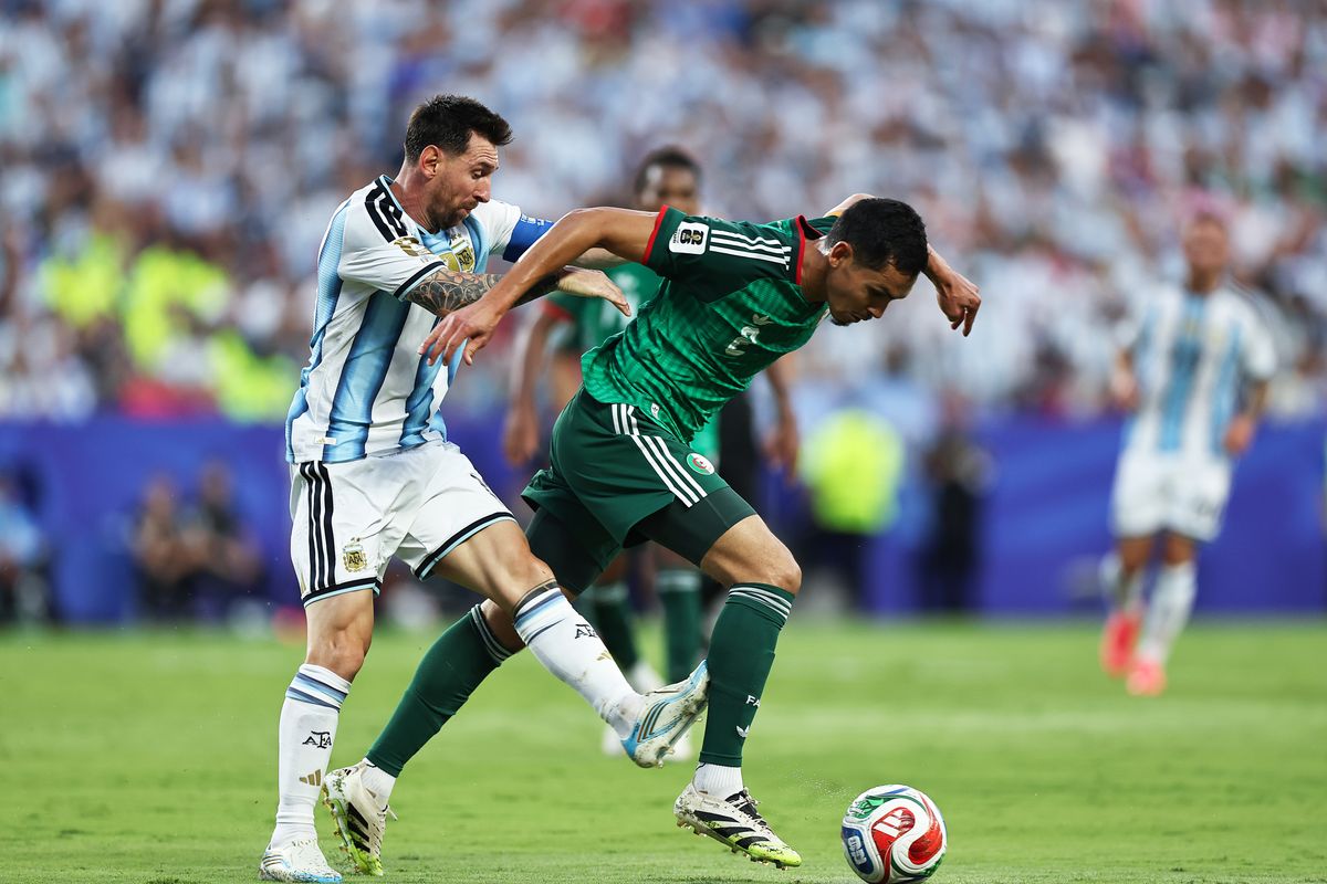 Lionel Messi and Aissa Mandi
