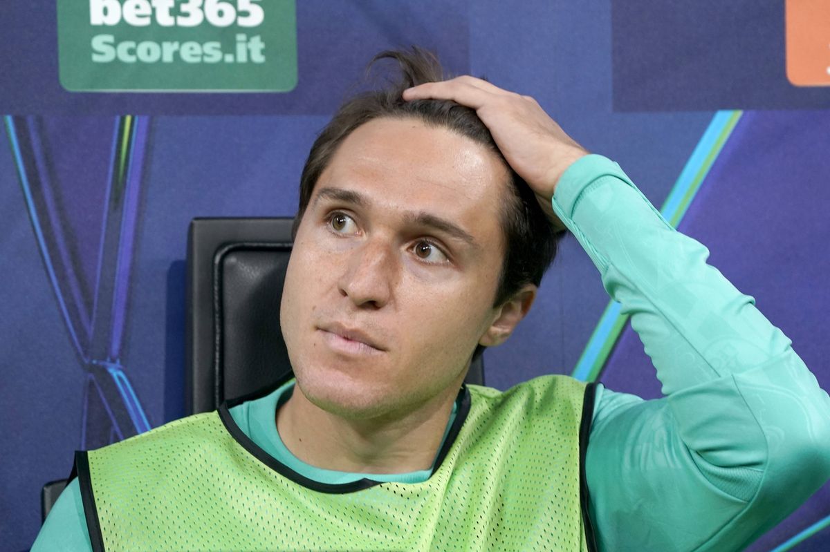 Federico Chiesa of Liverpool FC sitting on the bench looks during the UEFA Champions League 2024/25 League Phase MD1 match between AC Milan and Liverpool FC at Stadio San Siro