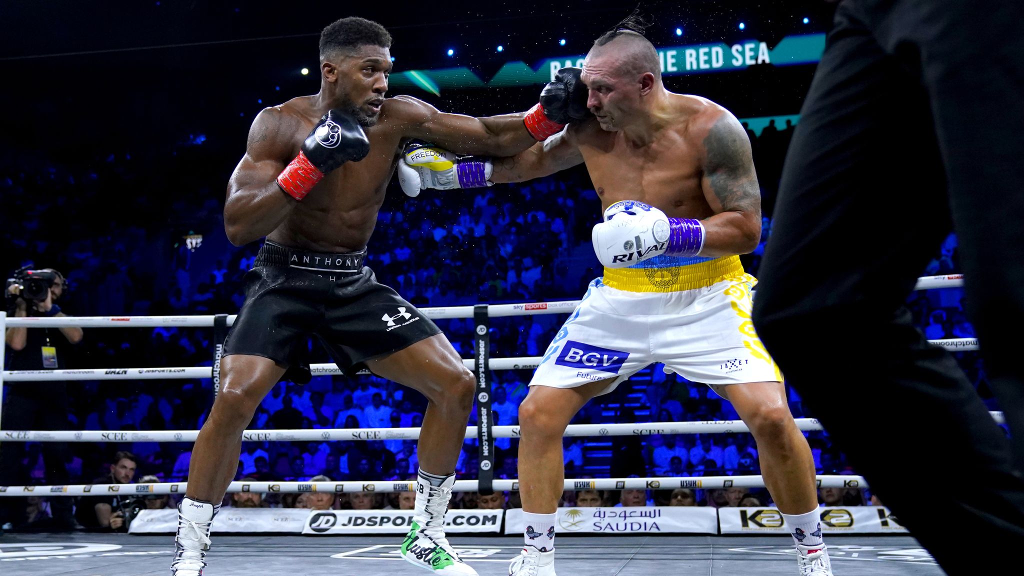 Joshua (left) trained with Usyk's (right) camp in preparation for his bout against Kristian Prenga