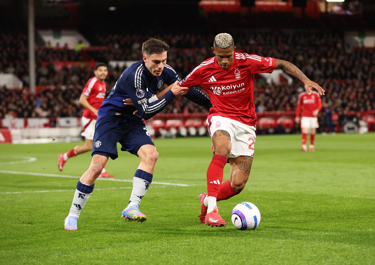 NOTTINGHAM, ENGLAND - APRIL 01: Danilo of Nottingham Forest is challenged by Manuel Ugarte of Manchester United during the Premier League match between Nottingham Forest FC and Manchester United FC at City Ground on April 01, 2025 in Nottingham, England. (Photo by Cameron Smith - Danehouse/Getty Images)