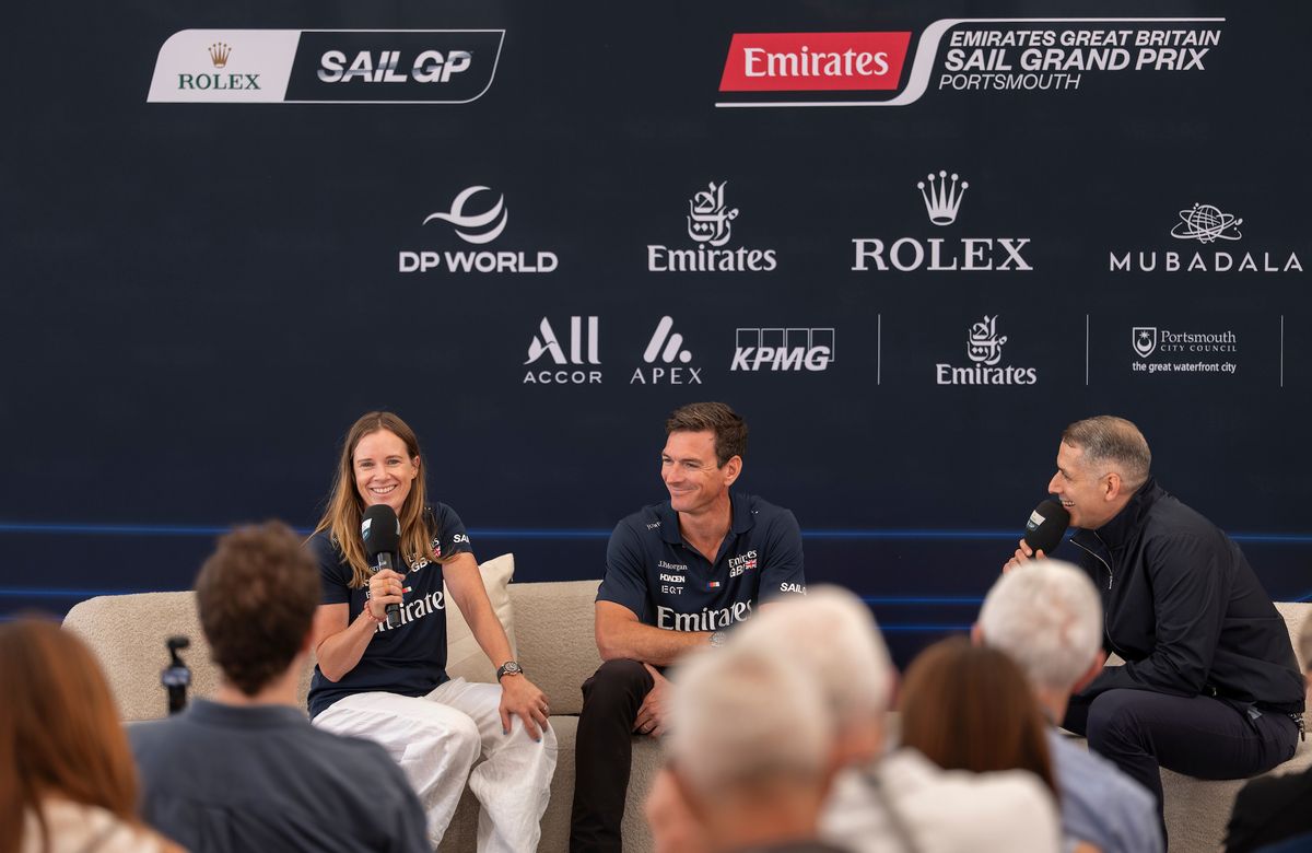 Presenter David Garrido speaks with Hannah Mills, strategist of Emirates Great Britain SailGP Team, and Dylan Fletcher, driver of Emirates Great Britain SailGP Team, during the pre-event press conference in the Adrenaline Lounge ahead of the Emirates Great Britain Sail Grand Prix in Portsmouth