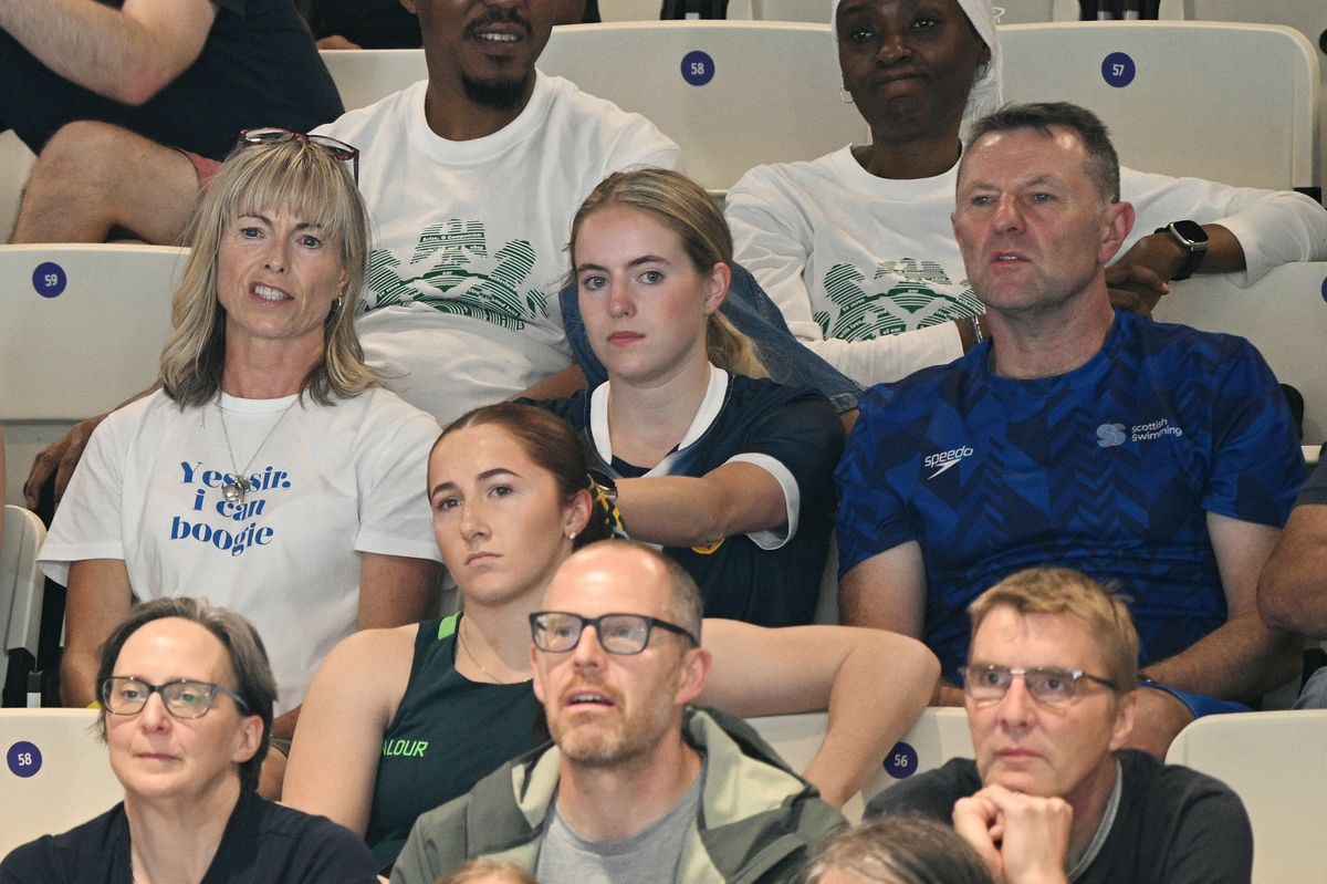 Kate (up L) and Gerry McCann (up R), parents of Scotland's Sean McCann, watch as he competes in the Men's 400m Freestyle Final during the swimming event at the Tollcross International Swimming Centre in Glasgow, on day two of the Commonwealth Games in Glasgow, Scotland, on July 25, 2026. (Photo by Oli SCARFF/AFP via Getty Images)