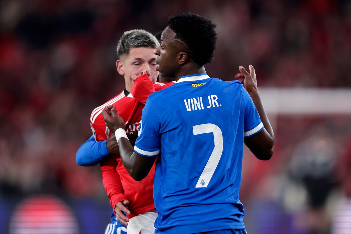 Vinicius Junior of Real Madrid in a clash with Gianluca Prestianni of Benfica during the UEFA Champions League  match between Benfica v Real Madrid at the Estadio Da Luz