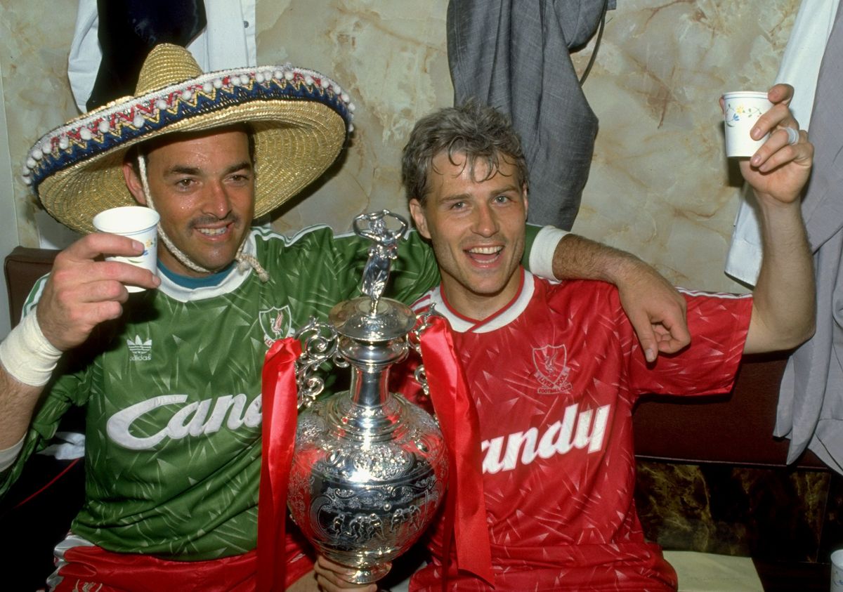 1 May 1990:  Bruce Grobbelaar (left) and Glenn Hysen of Liverpool celebrate with the trophy after the Barclays League Division One match against Derby County at Anfield in Liverpool, England. Liverpool won the match 1-0 and became league champions. \ Mandatory Credit: Dan Smith/Allsport