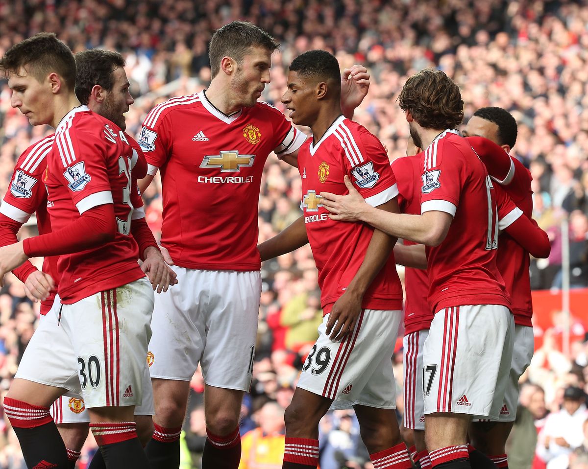 Michael Carrick and Marcus Rashford of Manchester United