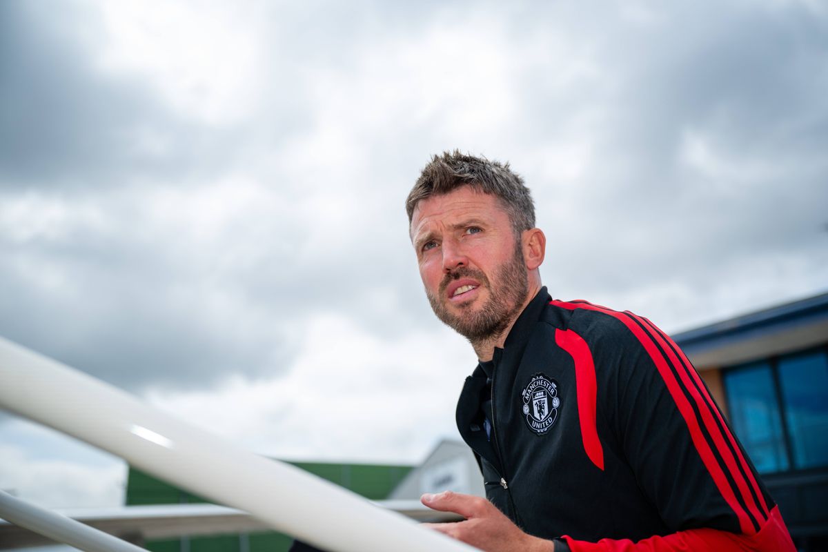 MANCHESTER, ENGLAND- JULY 23: (EXCLUSIVE COVERAGE). Head Coach Michael Carrick of Manchester United checks in ahead of their flight to Trondheim at Manchester Airport on July 23, 2026 in Manchester, England. (Photo by Ash Donelon/Manchester United via Getty Images)