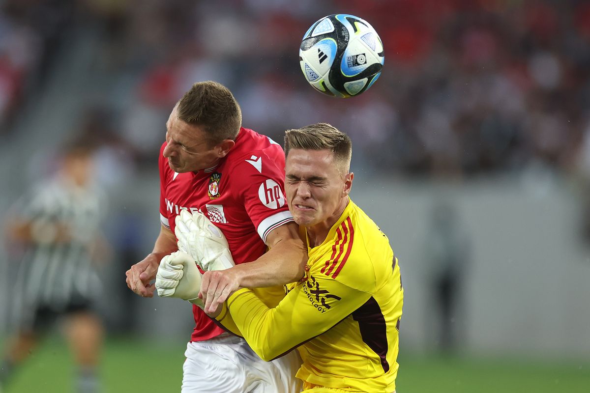 Paul Mullin (L) was hospitalised after colliding with Nathan Bishop (R) during a pre-season friendly between Wrexham and Man Utd in 2023