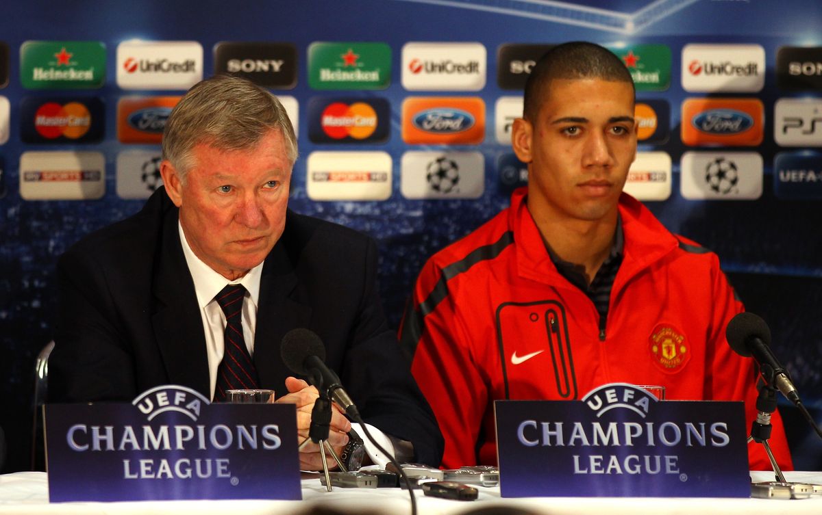 Sir Alex Ferguson the manager of Manchester United and Chris Smalling face the media during a press conference held at Old Trafford on March 14, 2011 in Manchester, England.