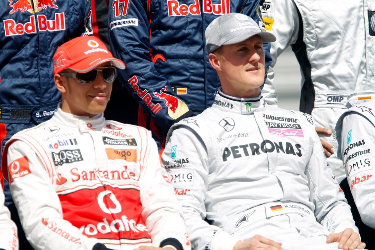 Lewis Hamilton, McLaren MP4-25 Mercedes, with Michael Schumacher, Mercedes GP W01.
