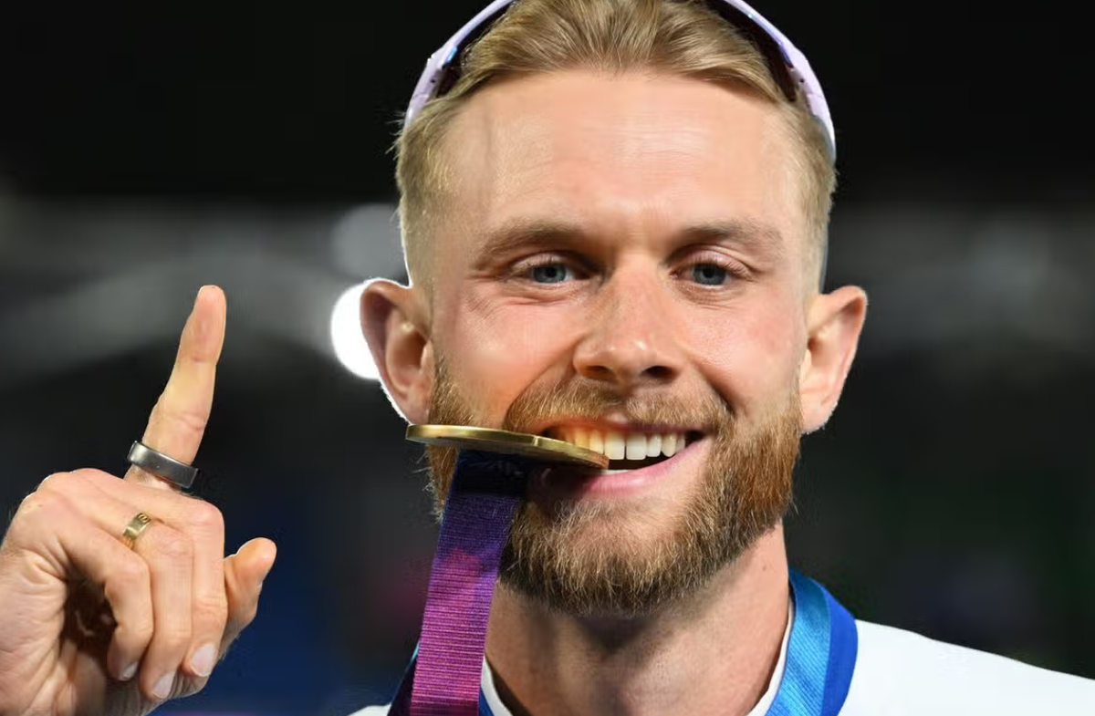 Josh Kerr of Team Scotland with a Gold Medal for winning the Mens One Mile Final at Scotstoun Stadium