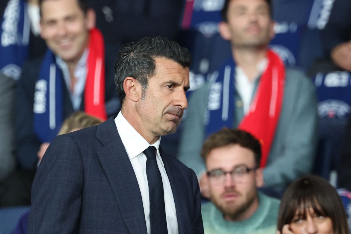 Luis Figo in the crowd at a match