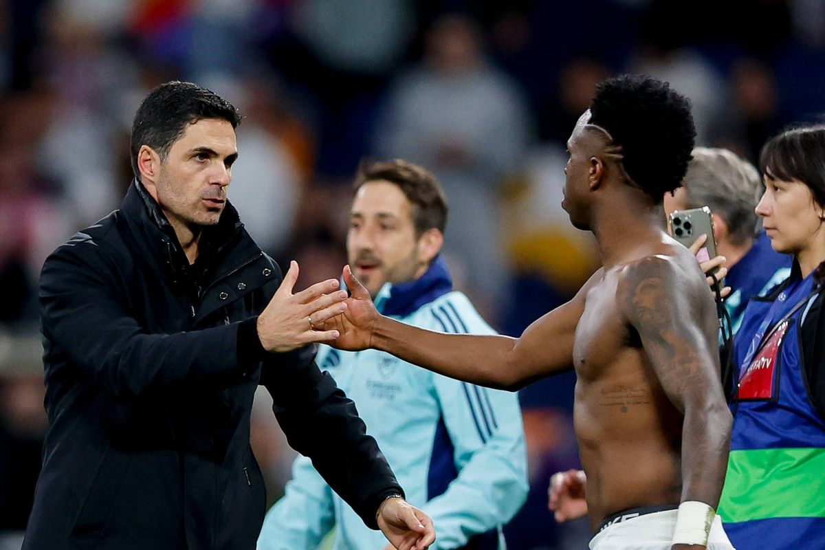 Mikel Arteta of Arsenal and Vinicius Junior of Real Madrid shake hands during the UEFA Champions League 2024/25 Quarter Final Second Leg match between Real Madrid C.F. and Arsenal FC at Estadio Santiago Bernabeu on April 16, 2025 in Madrid, Spain.