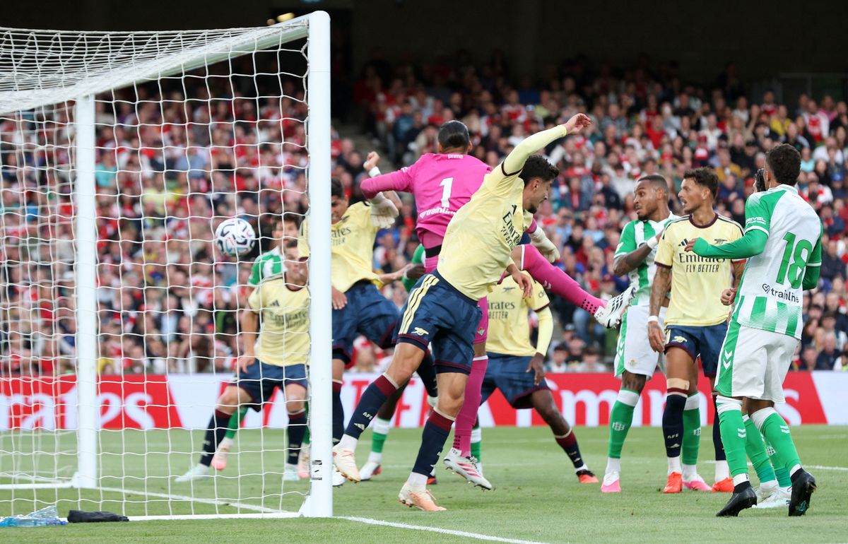 Real Betis' Spanish goalkeeper #01 Alvaro Valles concedes a goal from Arsenal's Ecuadorian defender #05 Piero Hincapie during the friendly pre-season football match between Arsenal and Real Betis, at the Aviva Stadium in Dublin, Ireland on August 5, 2026. (Photo by Paul Faith/AFP via Getty Images)