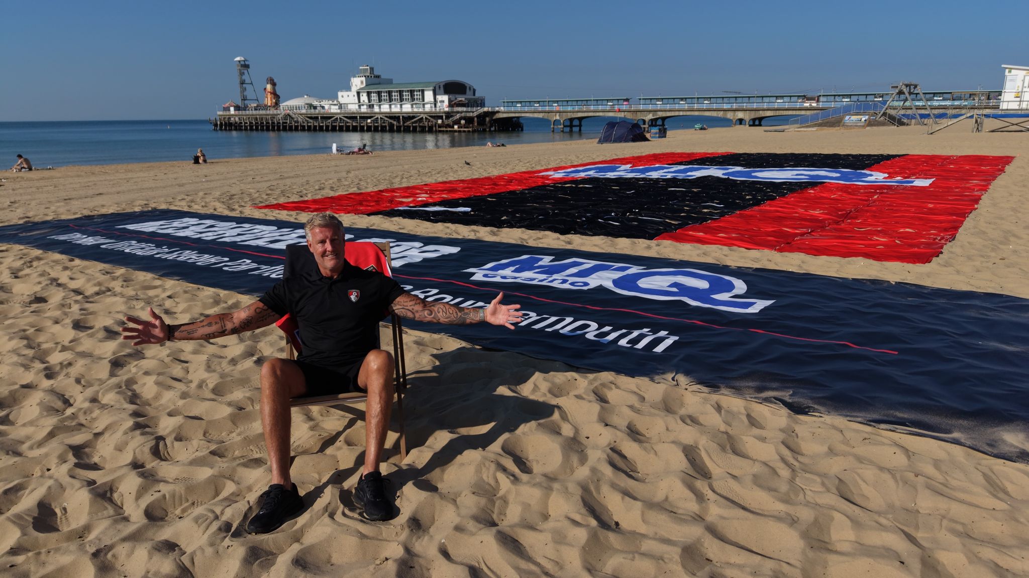 MrQ is the new Official Sleeve Partner of AFC Bournemouth. MrQ has unveiled "Reserved for MrQ" - a giant towel mosaic on Bournemouth. beach celebrating the new partnership