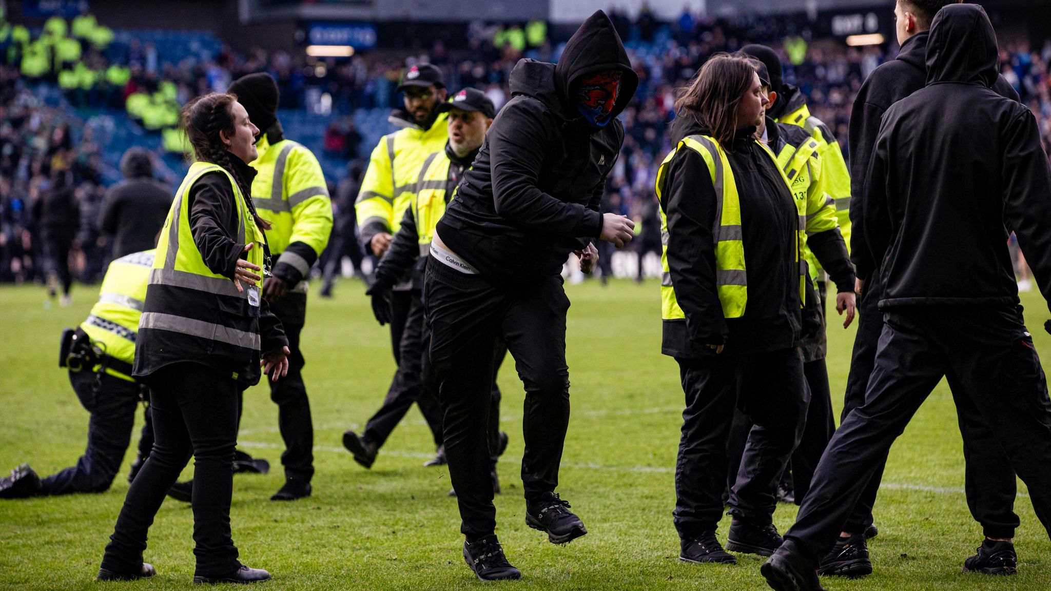 Fans stormed the pitch after last season's Scottish Cup tie at Ibrox