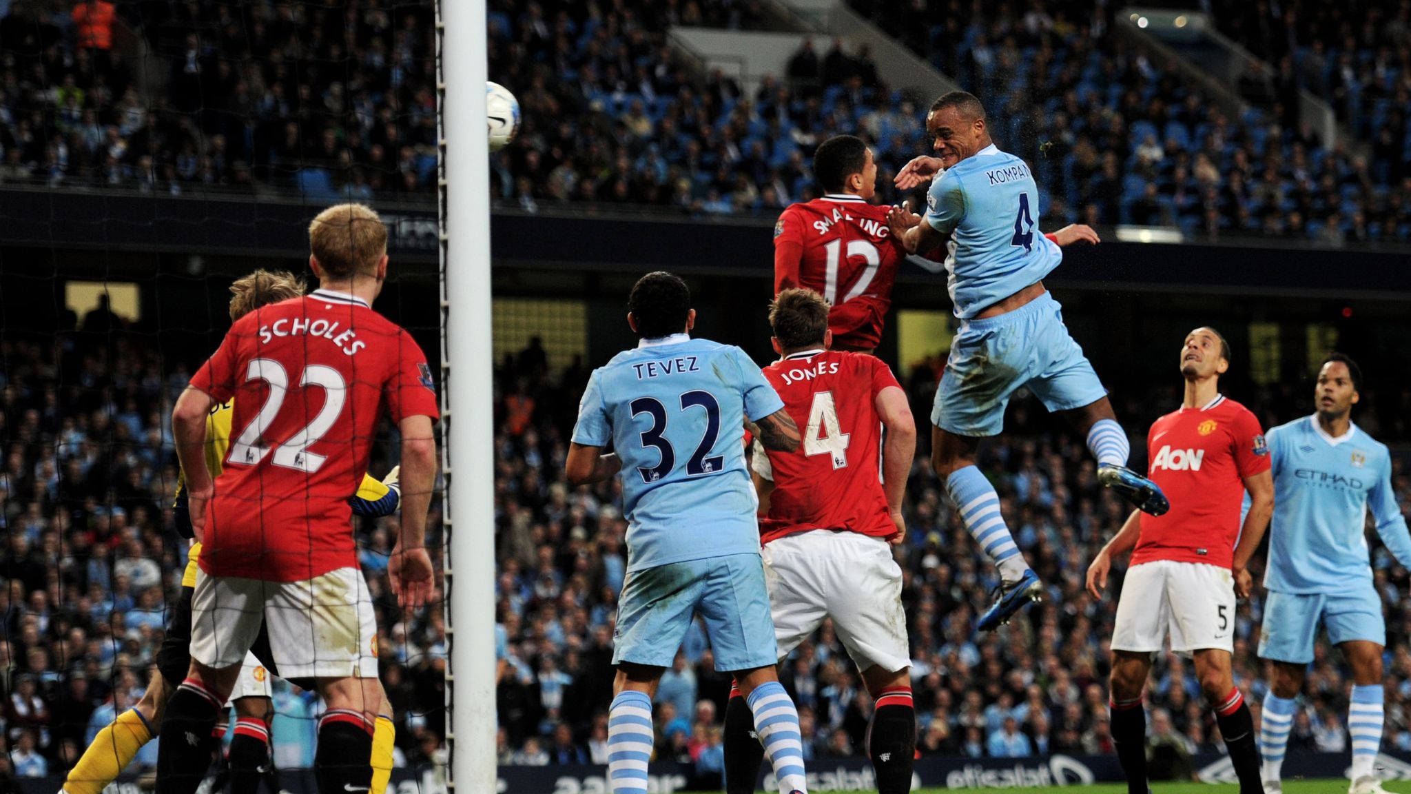 Vincent Kompany heads in a Manchester derby winner in April 2012