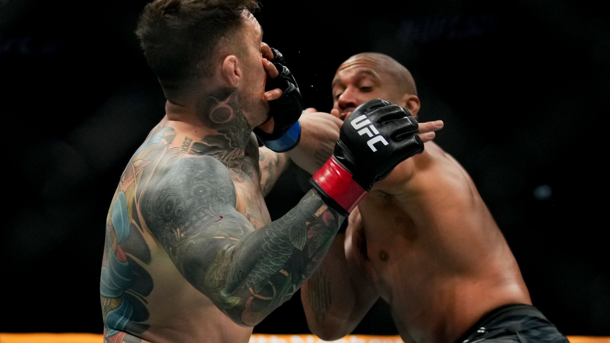 Ciryl Gane pokes the eye of Tom Aspinall during their heavyweight title bout (AP Photo/Altaf Qadri)
