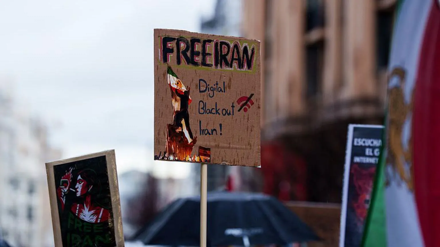 Europa Press via image of a cardboard protest sign, reading 