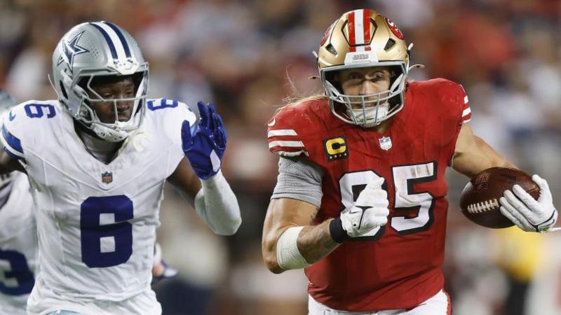 George Kittle of the San Francisco 49ers runs with the ball after a catch against the Dallas Cowboys in October 2024