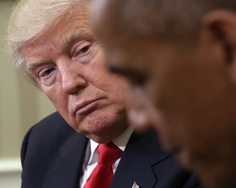 Then-president Barack Obama speaks while meeting with President-elect Donald Trump looks on in 2016