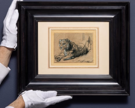 a person holding a framed image 