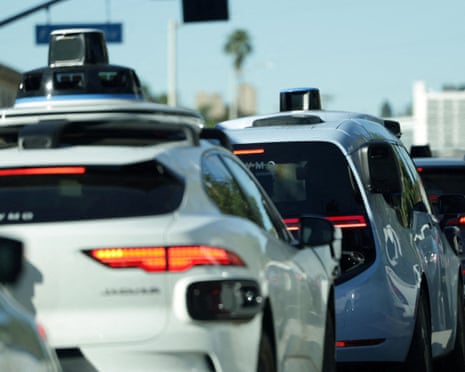 waymos drive on a los angeles street