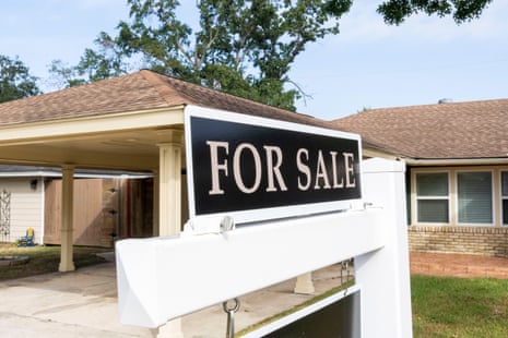 a 'for sale' sign outside a home