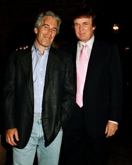 Two men, one with his arm on the other’s shoulder