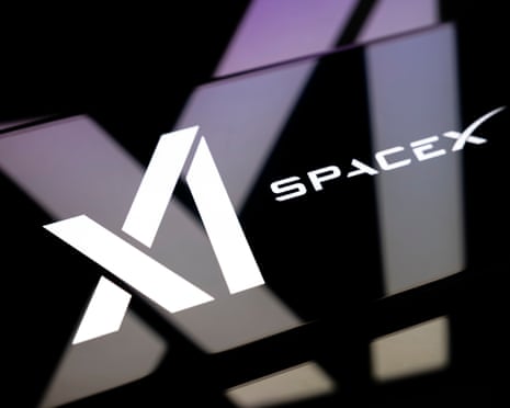 The xAI and SpaceX logos on a smartphone screen placed on a reflective surface on to which the xAI logo is projected. 