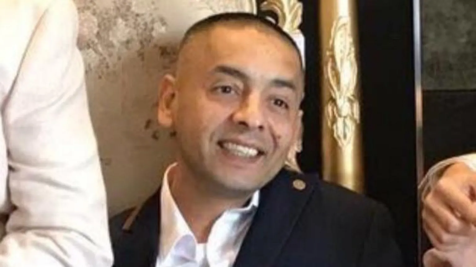 Cambridgeshire Police A man in a white collared shirt and navy jacket is pictured smiling.