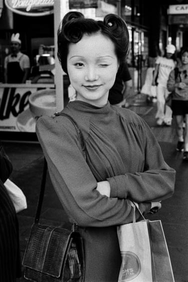 a young woman winks at the camera