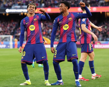 Lamine Yamal (left) celebrates with teammate Alejandro Balde after scoring Barcelona’s second goal