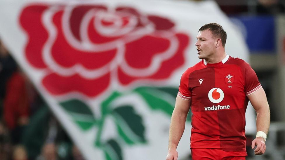 Dewi Lake with the English red rose flag behind him