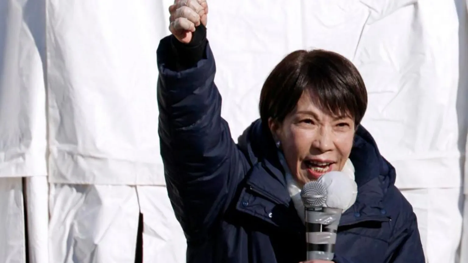 EPA Sanae Takaichi, in a navy winter jacket, pumps her fist into the air as she speaks at a rally in Urawa, near Tokyo, on 3 February