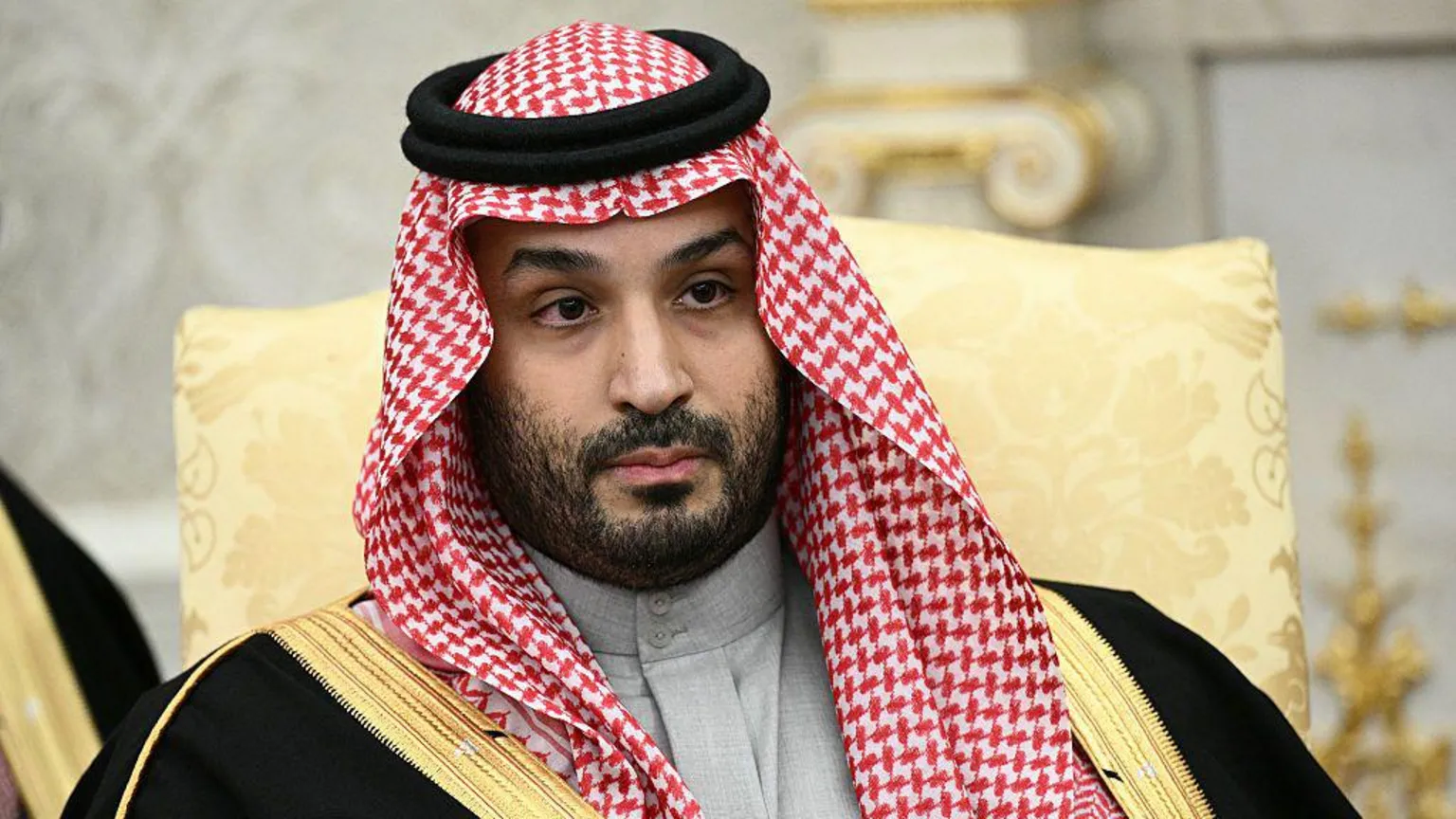  Crown Prince Mohammed bin Salman looks on during a meeting with US President Donald Trump (not pictured) in the Oval Office of the White House in Washington, DC on November 18, 2025. 