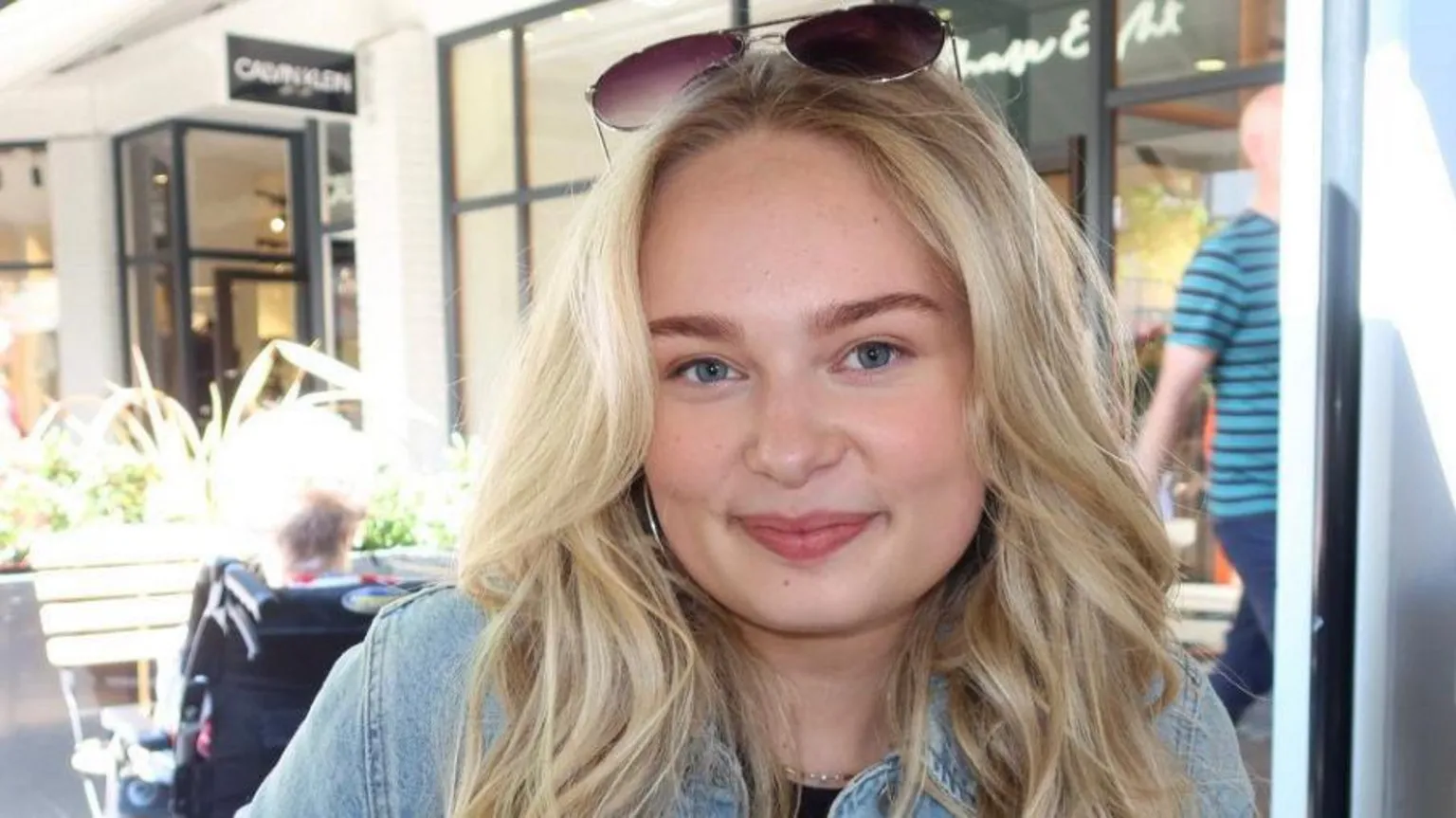 Amy Laird A woman with blonde hair and a denim jacket