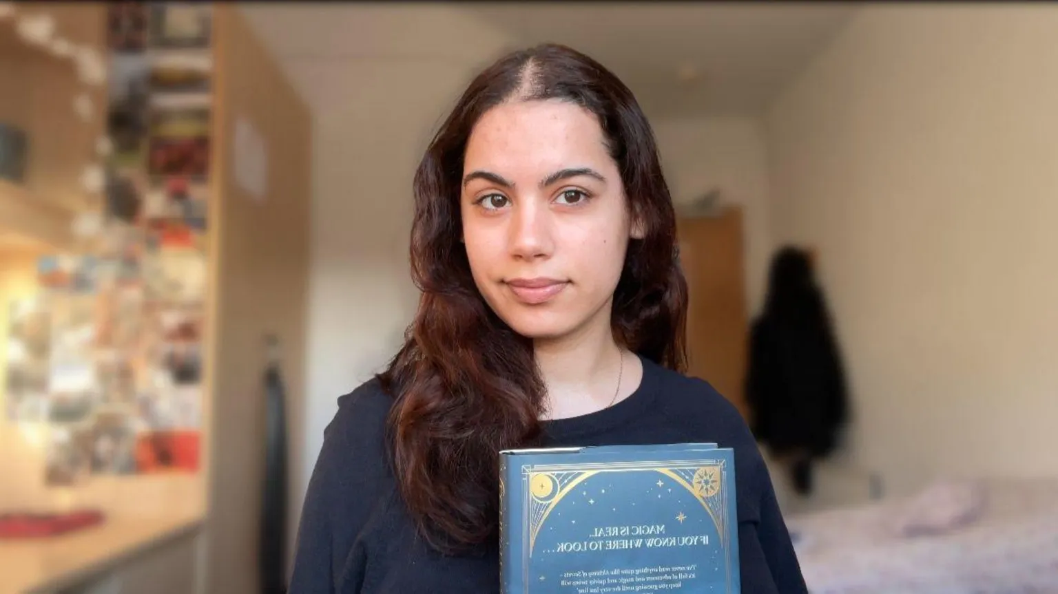 Isabella Potamitis Briozzo A woman with black hair and a black top.