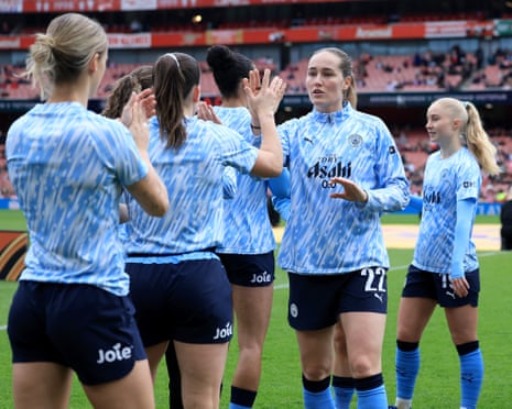 Manchester City players warm up at the Emirates.