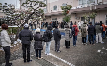 People queue up at a polling station in Kawasaki, Kanagawa prefecture