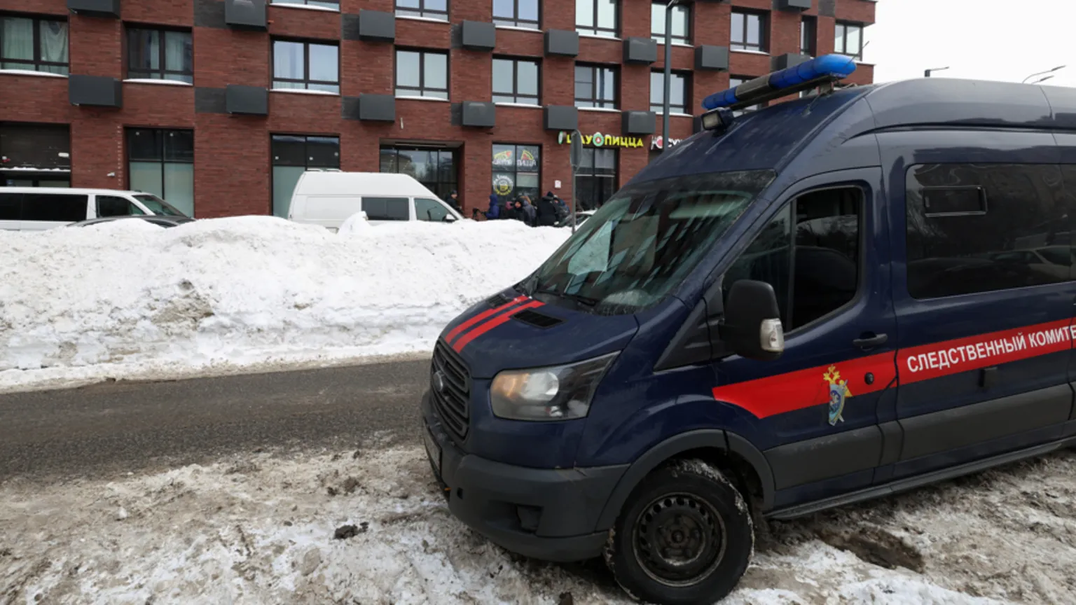  A van belonging to the Russian Investigative Committee is parked outside a residential building where the assassination attempt on Russian Lieutenant General Vladimir Alexeyev took place in Moscow, Russia February 6