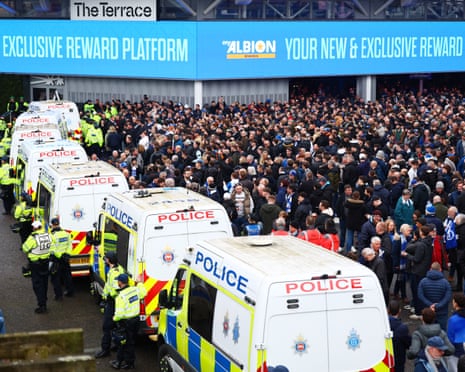 Brighton fans are separated from visiting supporters by a police cordon outside the Amex.