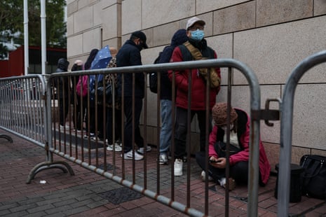 People queue to enter the West Kowloon Magistrates’ Courts building for sentencing in the national security collusion trial of Jimmy Lai, founder of the now-defunct pro-democracy newspaper Apple Daily, in Hong Kong, China, February 9, 2026.