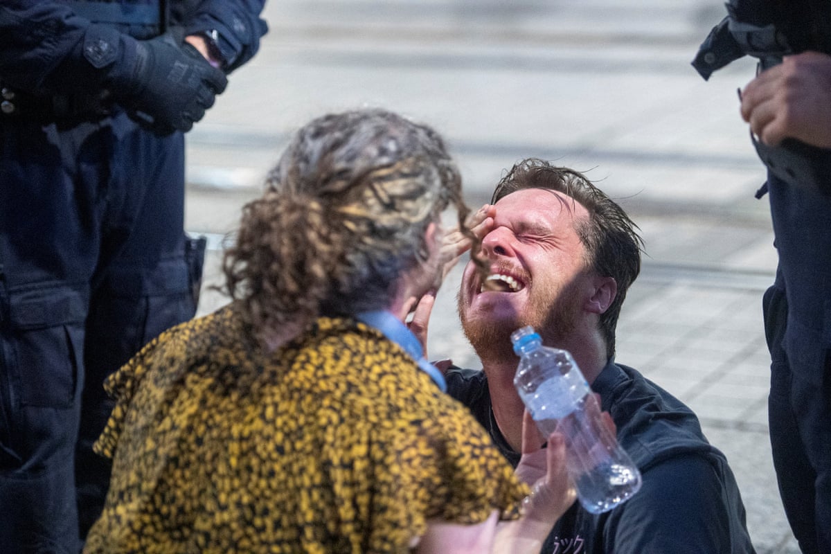 A man reacts after being tear-gassed by NSW police at a pro-Palestine protest in Sydney last night.
