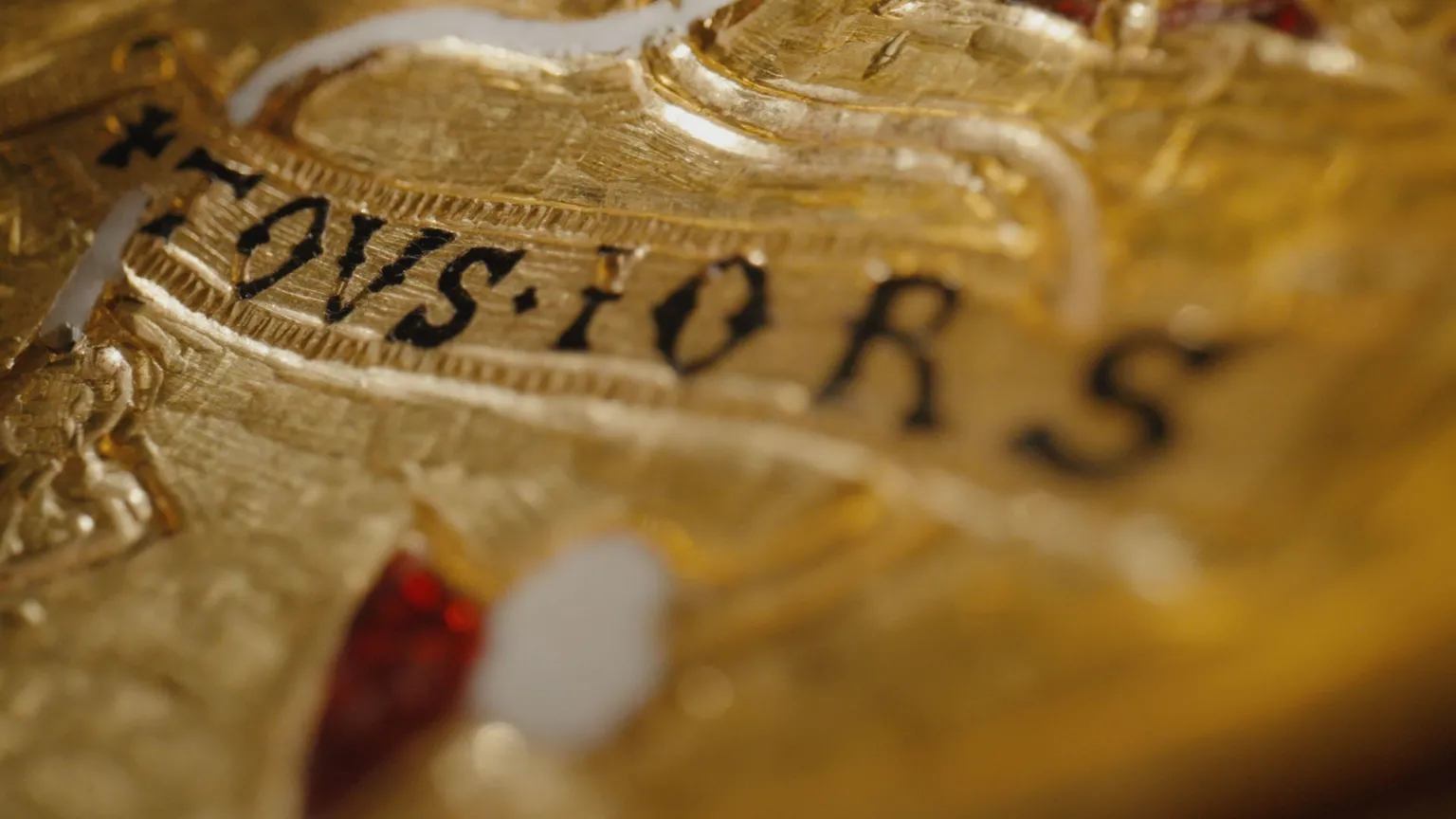  A close-up image of the pendant, showing the letters 