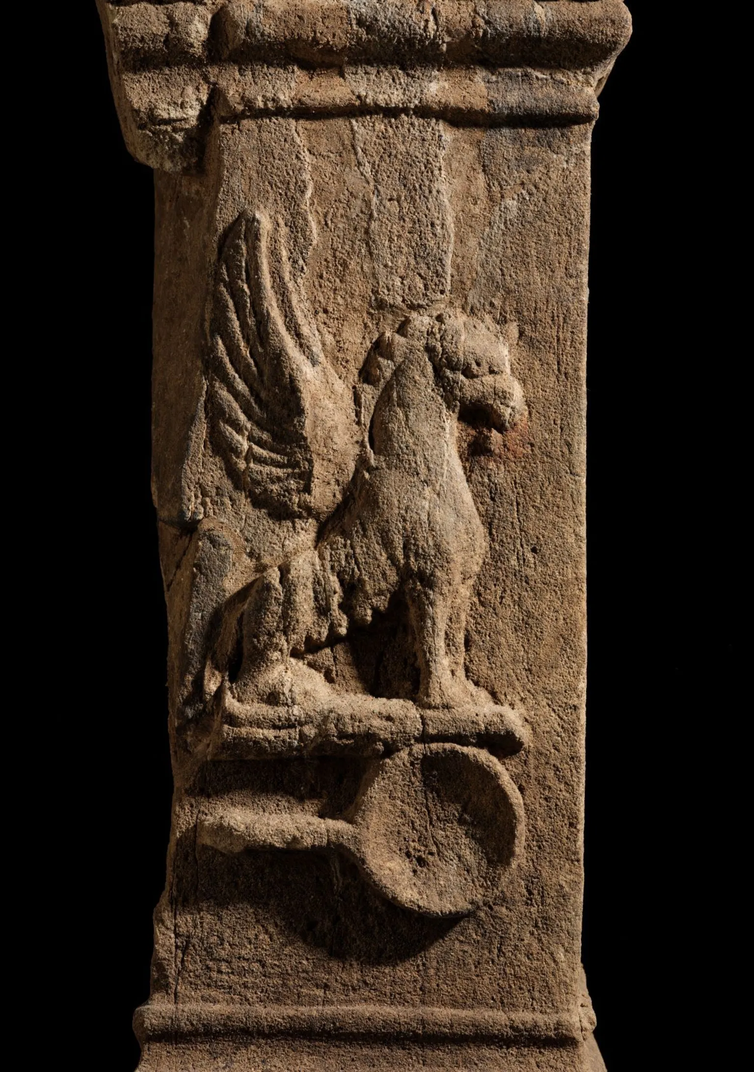 National Museums Scotland Ancient Roman altar with a griffin symbol.