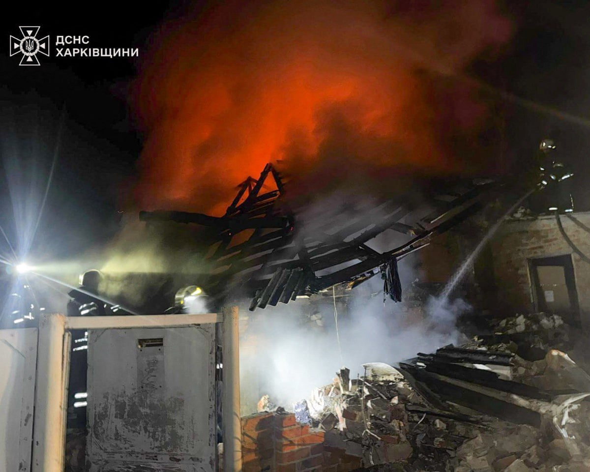 Firefighters working to extinguish a fire at a private house following a Russian drone attack in Bogodukhiv Kharkiv region of Ukraine.