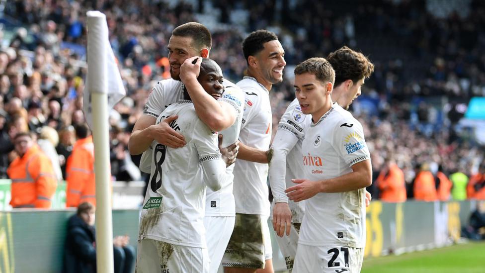 Leo Walta celebrates with his new Swansea team-mates 