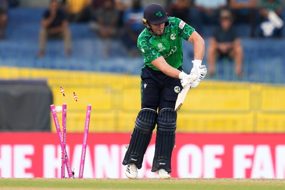 Ireland's Ross Adair is bowled out by Australia's Nathan Ellis.